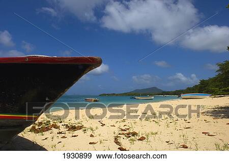 Stock Photo - Low Angle View Of The Tip Of A Boat On The Sands Of Paradise Beach, Carriacou Islands; Grenada, Caribbean. Fotosearch