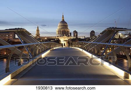 Stock Image - Low angle view The Millennium Bridge looking North towards St Paul's Cathedral, London, England, UK, London, England, UK, Europe.. Fotosearch