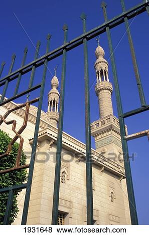 Stock Photo - Low Angle View Through A Gate Of Two Minarets On The Badr Mosque, Port Tewfik, Suez Canal, Egypt; Port Tewfik, Suez Canal, Egypt. Fotosearch