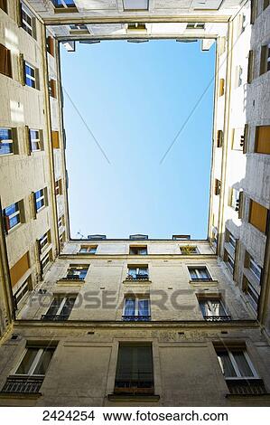 Low angle view up the side of a residential building in the historical district of Marais; Paris, France View Large Photo Image Picture - Low angle view up the side of a residential building in the historical district of Marais; Paris, France. Fotosearch