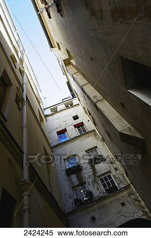 Low angle view up the side of residential buildings in the historical district of Marais; Paris, France View Large Photo Image Stock Photography - Low angle view up the side of residential buildings in the historical district of Marais; Paris, France. Fotosearch
