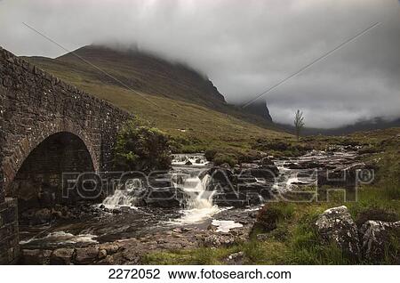 Low Clouds Over A Landscape With A Stream Cascading Over Rocks And Under A Bridge; Applecross Peninsula Scotland View Large Photo Image Stock Image - Low Clouds Over A Landscape With A Stream Cascading Over Rocks And Under A Bridge; Applecross Peninsula Scotland. Fotosearch