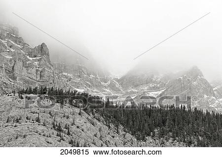 Stock Photography - Low Clouds Over The Rocky Mountains, Banff National Park, Alberta. Fotosearch