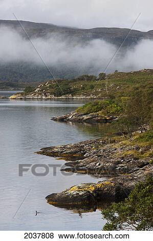 Stock Photo - Low Hanging Cloud Along The Shoreline; Argyll Scotland. Fotosearch
