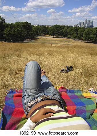Low Section Of Woman Relaxing On Blanket In Park View Large Photo Image Stock Image - Low Section Of Woman Relaxing On Blanket In Park. Fotosearch