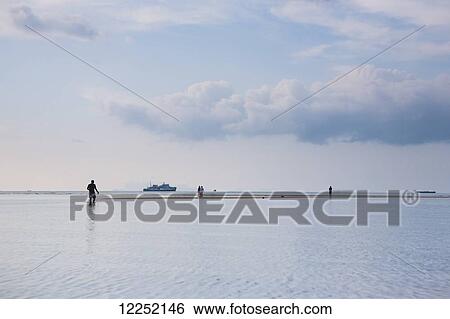 Stock Photograph - Low tide at Nathon Beach on Ko Samui; Nathon, Ko Samui, Thailand. Fotosearch
