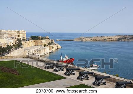 Lower Barrakka Gardens Showing The Monument To Sir Alexander Ball, With The Old Customs House And The Breakwater Below, As Seen From Upper Barrakka Gardens, Valletta, Malta View Large Photo Image Stock Image - Lower Barrakka Gardens Showing The Monument To Sir Alexander Ball, With The Old Customs House And The Breakwater Below, As Seen From Upper Barrakka Gardens, Valletta, Malta. Fotosearch