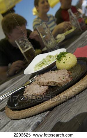 Stock Photography - Lunch at the Einsiedelei mountain inn. Kitzbuehel. Tyrol. Austria.. Fotosearch
