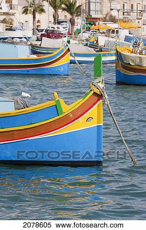 Luzzu, A Traditional Maltese Fishing Boat In The Harbour, Marsaxlokk, Malta View Large Photo Image Stock Photography - Luzzu, A Traditional Maltese Fishing Boat In The Harbour, Marsaxlokk, Malta. Fotosearch