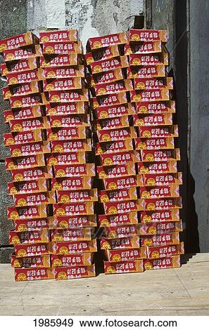 Stock Photo - Macau, Goods Stacked In Front Of Building.. Fotosearch