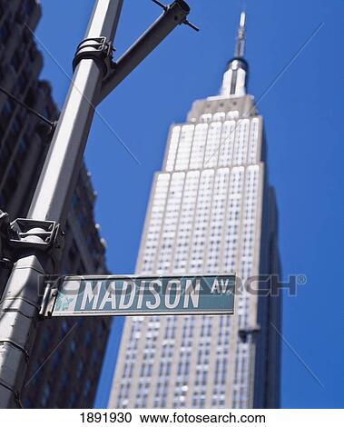 Stock Image - Madison Avenue Sign With Empire State Building. Fotosearch
