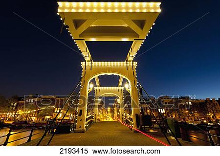 Stock Photography - Magere Brug Or Skinny Bridge At Duskamsterdam, Holland.. Fotosearch
