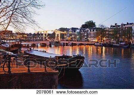 Magere Brug Over The Amstel River At Night, Amsterdam, Netherlands View Large Photo Image Stock Image - Magere Brug Over The Amstel River At Night, Amsterdam, Netherlands. Fotosearch
