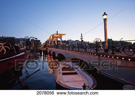 Magere Brug Over The Amstel River At Night, Amsterdam, Netherlands View Large Photo Image Stock Photograph - Magere Brug Over The Amstel River At Night, Amsterdam, Netherlands. Fotosearch