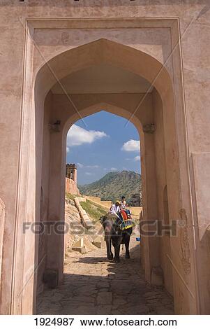 Mahout And Tourist On Elephant Coming Up Path Through Gateway, Amber Fort Near Jaipur, Rajasthan, India View Large Photo Image Stock Photo - Mahout And Tourist On Elephant Coming Up Path Through Gateway, Amber Fort Near Jaipur, Rajasthan, India. Fotosearch