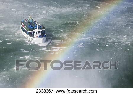 Stock Photo - Maid Of The Mist Boat Near Niagara Falls With Rainbow And Mist; Niagara Falls, New York, United States Of America. Fotosearch
