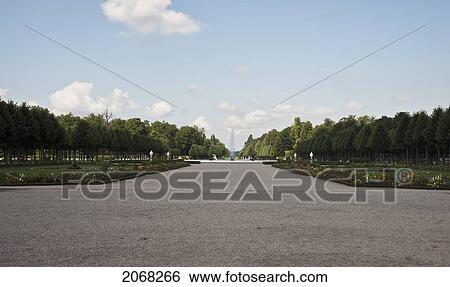 Stock Photograph - Main Avenue Of Schwetzingen Castle Gardens Looking Towards Fountain; Schwetzingen Baden-Wurtenburg Germany. Fotosearch