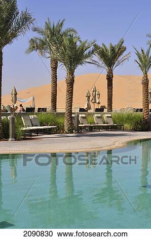 Stock Image - Main Pool And Dunes, Qasr Al Sarab, Abu Dhabi. Fotosearch