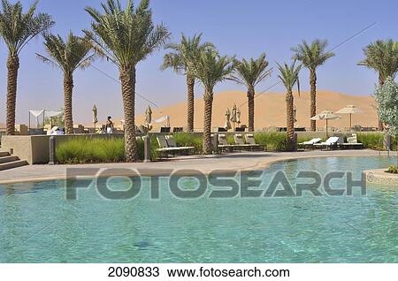 Stock Image - Main Pool And Dunes, Qasr Al Sarab, Abu Dhabi. Fotosearch