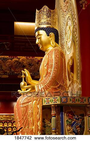 Stock Image - Maitreya Buddha In Buddha Tooth Relic Temple & Museum; Singapore, Singapore. Fotosearch