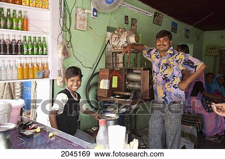 Making Fresh Sugar Cane Juice, Gwalior, Madhya Pradesh, India View Large Photo Image Stock Photo - Making Fresh Sugar Cane Juice, Gwalior, Madhya Pradesh, India. Fotosearch