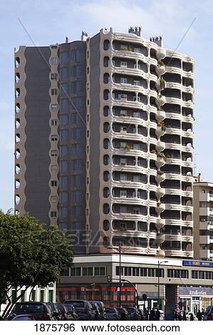 Stock Photograph - Malaga, Andalusia, Spain; A Tall Building And City Street. Fotosearch