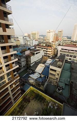Malaysia, Chinatown; Kuala Lumpur, View over rooftops and city centre from hotel View Large Photo Image Stock Image - Malaysia, Chinatown; Kuala Lumpur, View over rooftops and city centre from hotel. Fotosearch
