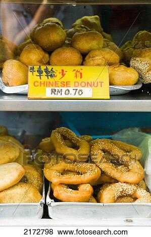 Malaysia, Kuala Lumpur, Chinatown, Chinese donuts for sale out in street; Jalan Petaling (Petaling Street) View Large Photo Image Stock Photo - Malaysia, Kuala Lumpur, Chinatown, Chinese donuts for sale out in street; Jalan Petaling (Petaling Street). Fotosearch