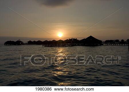 Malaysia, Mabul Island, Sipidan Water Village, Sunset Silhouettes Overwater Bungalows. View Large Photo Image Stock Photograph - Malaysia, Mabul Island, Sipidan Water Village, Sunset Silhouettes Overwater Bungalows.. Fotosearch