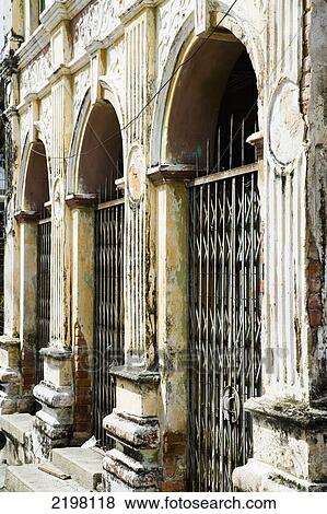 Malaysia, Pulau Pinang (Penang), Lebuh Pitt (Jalan Masjid Kapitan Keling) Road; Georgetown, Row of archways in dilapidated state of repair View Large Photo Image Stock Photo - Malaysia, Pulau Pinang (Penang), Lebuh Pitt (Jalan Masjid Kapitan Keling) Road; Georgetown, Row of archways in dilapidated state of repair. Fotosearch
