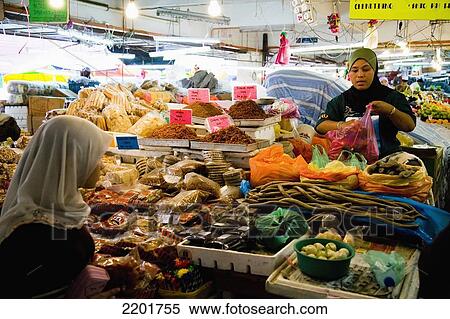 Malaysia, Terengganu, vegetables and other goods at large indoor Pasar Payang central market; Kuala Terengganu, Muslim women selling fruits View Large Photo Image Stock Photography - Malaysia, Terengganu, vegetables and other goods at large indoor Pasar Payang central market; Kuala Terengganu, Muslim women selling fruits. Fotosearch