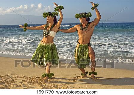 Male And Female Hula Dancers In Ti-Leaf, Haku, Lei, In A Dancing Pose On The Beach View Large Photo Image Stock Image - Male And Female Hula Dancers In Ti-Leaf, Haku, Lei, In A Dancing Pose On The Beach. Fotosearch