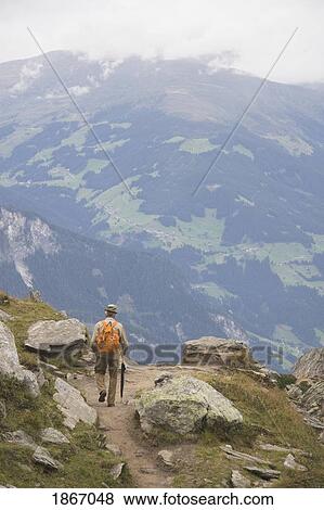 Male Hiker On A Trail, Mayrhofen, Tyrol (Tirol), Austria View Large Photo Image Stock Photo - Male Hiker On A Trail, Mayrhofen, Tyrol (Tirol), Austria. Fotosearch
