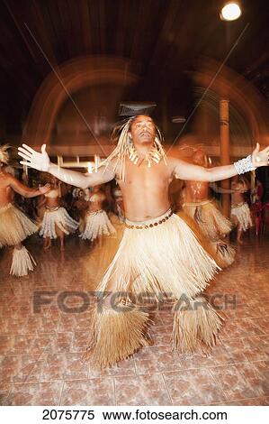 Stock Photography - Male Performer Of The Kari Kari Dance Troup Performing Polynesian Dances At The Hotel Hanga Roa, Rapa Nui (Easter Island), Chile. Fotosearch