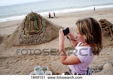 Malecon, Puerto Vallarta, Mexico; Young Girl Taking Photo Of Sand Sculpture View Large Photo Image Stock Image - Malecon, Puerto Vallarta, Mexico; Young Girl Taking Photo Of Sand Sculpture. Fotosearch