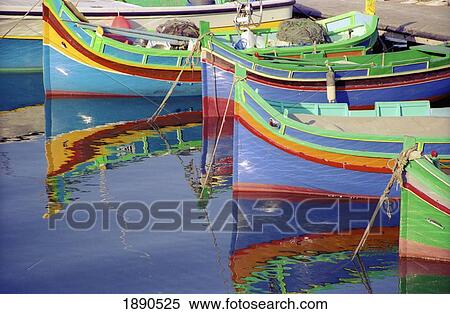 Stock Photography - Malta, Striped Boats Moored In Harbour; Gozo. Fotosearch