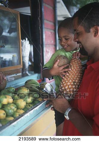 Man And Son Buying Fruit And Veg From Stall Near Speighstown On The West Coast Of Barbados. View Large Photo Image Stock Photo - Man And Son Buying Fruit And Veg From Stall Near Speighstown On The West Coast Of Barbados.. Fotosearch