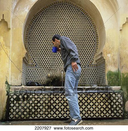 Man At Drinking Fountain, Fez, Morocco View Large Photo Image Stock Photo - Man At Drinking Fountain, Fez, Morocco. Fotosearch