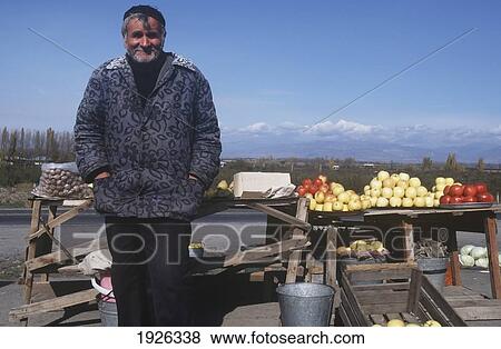 Stock Photo - Man At Market Stall. Fotosearch