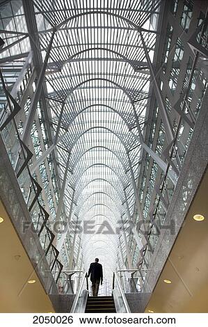 Man At The Top Of An Escalator, Brookfield Place, Toronto, Ontario View Large Photo Image Stock Photograph - Man At The Top Of An Escalator, Brookfield Place, Toronto, Ontario. Fotosearch