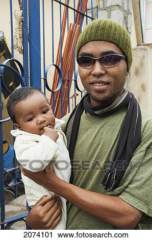 Man & Baby In Antananarivo, Madagascar View Large Photo Image Stock Image - Man & Baby In Antananarivo, Madagascar. Fotosearch