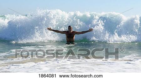 Stock Image - Man Body Surfing. Fotosearch