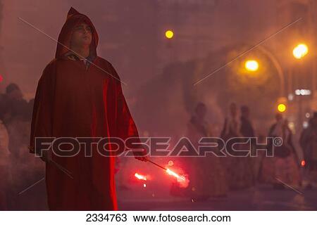 Man Carrying Small Red Firework In Fire Parade During Fallas Festival; Valencia, Spain View Large Photo Image Stock Image - Man Carrying Small Red Firework In Fire Parade During Fallas Festival; Valencia, Spain. Fotosearch