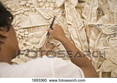 Stock Image - Man Carving Stone. Fotosearch