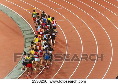 Stock Photograph - Man Competing In Race At Stadium, Rear View; London, England, Uk. Fotosearch