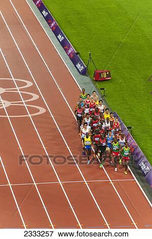 Man Competing In Race At Stadium; London, England, Uk View Large Photo Image Stock Photo - Man Competing In Race At Stadium; London, England, Uk. Fotosearch