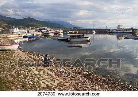 Man Contemplating Boats On Ohrid Lake, Ohrid, Macedonia View Large Photo Image Stock Image - Man Contemplating Boats On Ohrid Lake, Ohrid, Macedonia. Fotosearch