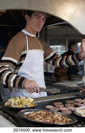 Man Cooking Food, Prishtina, Kosovo View Large Photo Image Stock Image - Man Cooking Food, Prishtina, Kosovo. Fotosearch