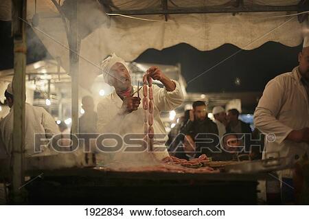 Picture - Man Cooking Sausages On Barbecue At Night Market, Jemaa L-Fna, Djemaa El Fna, Marrakesh, Morocco. Fotosearch