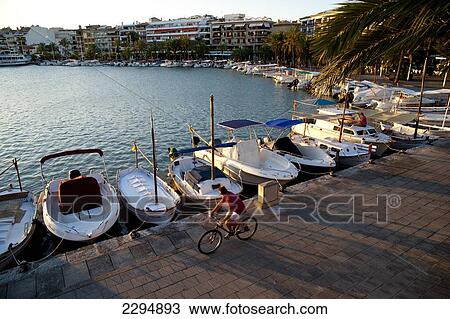 Man Cycling In Alcudia's Port At Sunset, Mallorca, Balearic Islands, Spain View Large Photo Image Stock Image - Man Cycling In Alcudia's Port At Sunset, Mallorca, Balearic Islands, Spain. Fotosearch